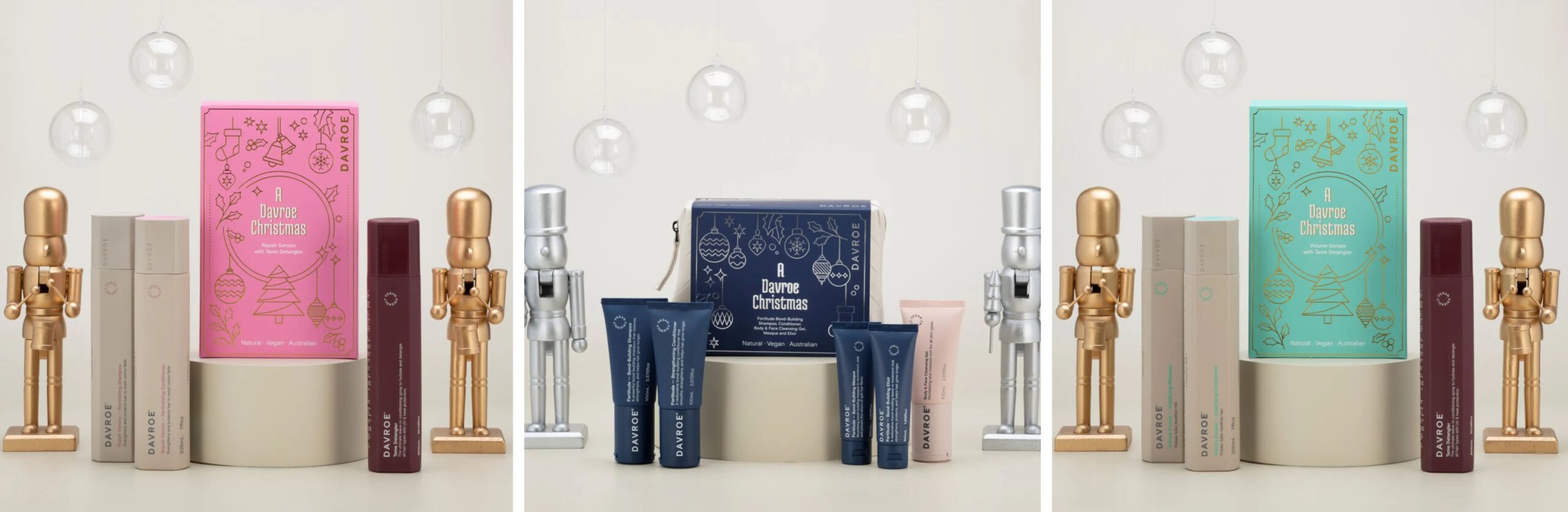 Kolaż przedstawiający świąteczne zestawy prezentowe do włosów marki Davroe: różowy zestaw Repair Senses, niebieski zestaw podróżny w kosmetyczce Fortitude oraz turkusowy zestaw Volume Senses w otoczeniu złotych i srebrnych dziadków do orzechów.